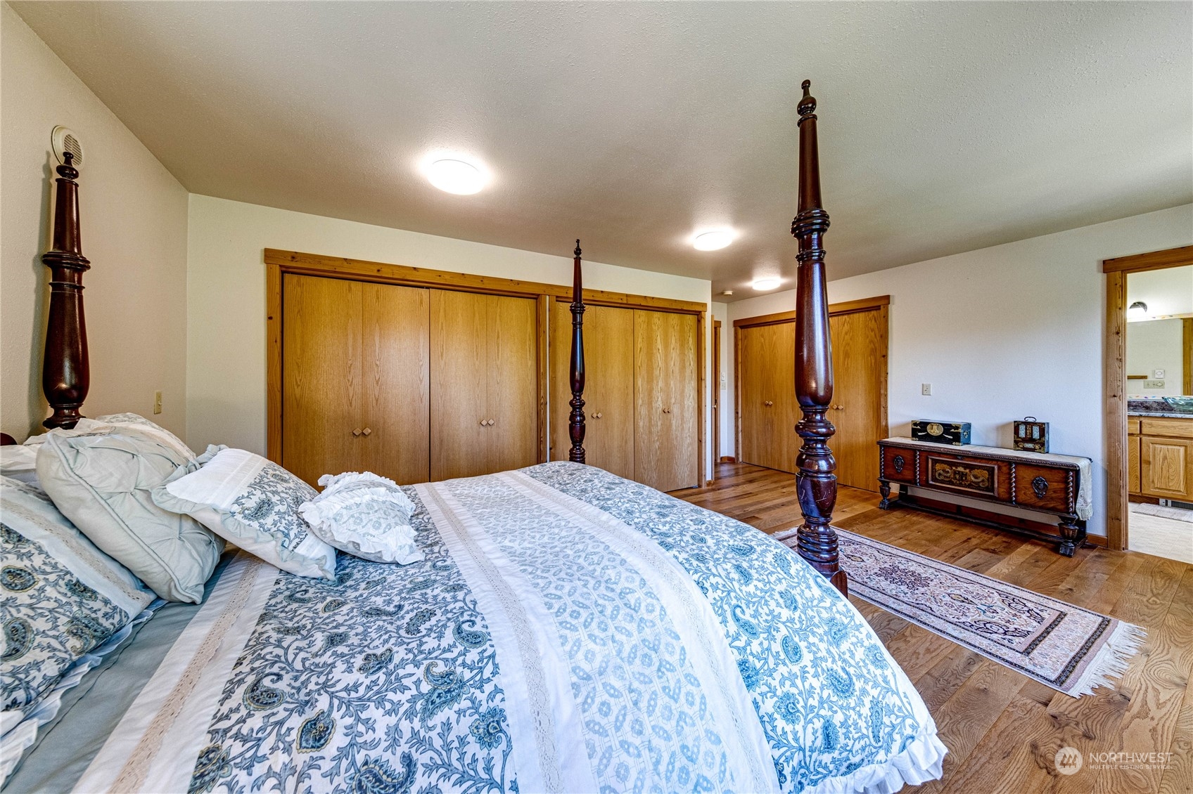 443 Westridge Road Port Angeles, WA 98363 - Photo 25 of 40 a bedroom with a bed and wooden floor