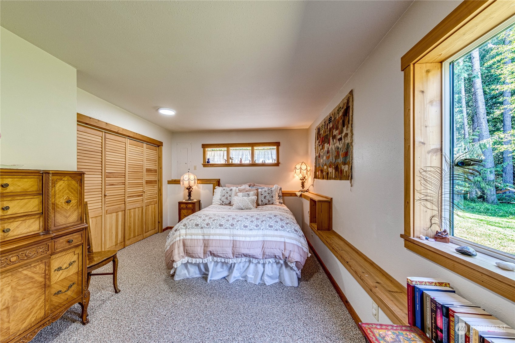 443 Westridge Road Port Angeles, WA 98363 - Photo 31 of 40 a bedroom with a large bed and a window