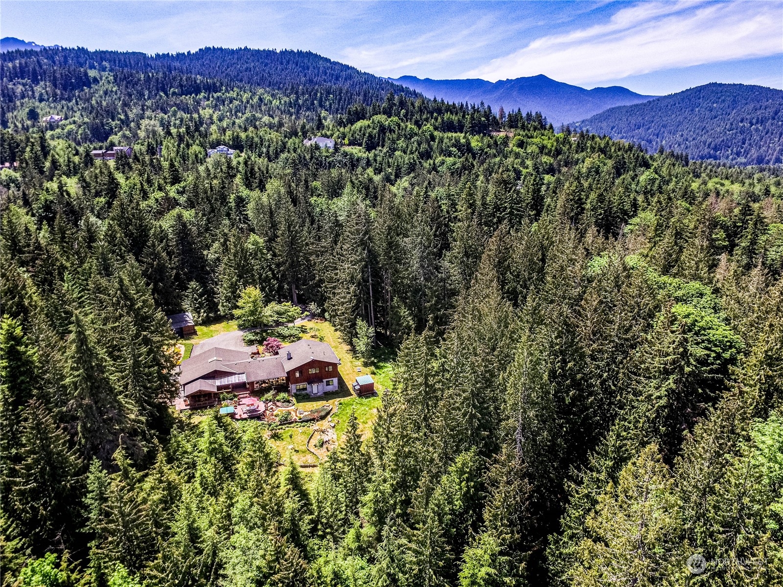 443 Westridge Road Port Angeles, WA 98363 - Photo 40 of 40 a view of a lush green hillside and a houses