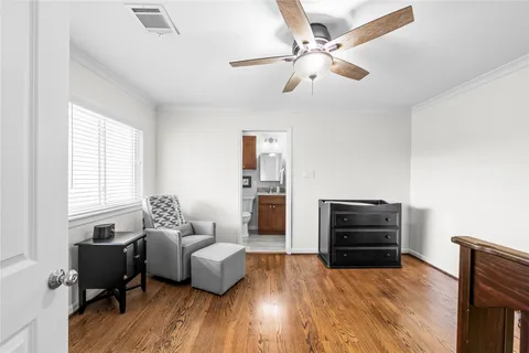 a kitchen with stainless steel appliances granite countertop a refrigerator a sink and wooden floors