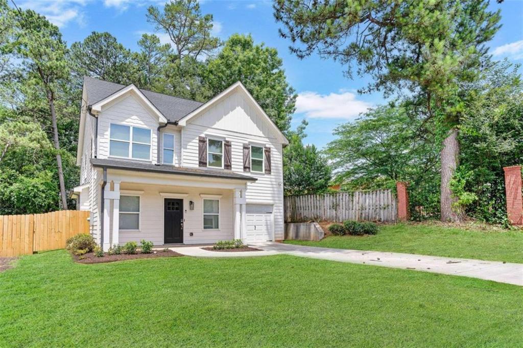 1499 Rupert Road Decatur, GA 30032 - Photo 1 of 1 a front view of a house with a yard and trees