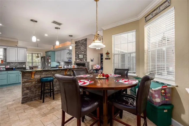 an aerial view of a house with a yard and lake view