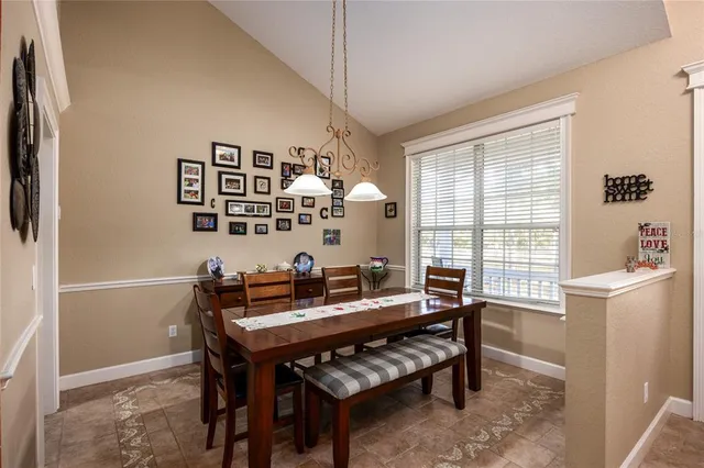 a en suite spacious bathroom with a granite countertop tub and a large window