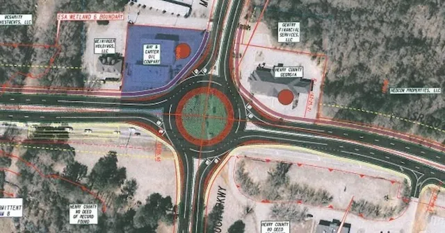 a view of swimming pool with a garden and plants