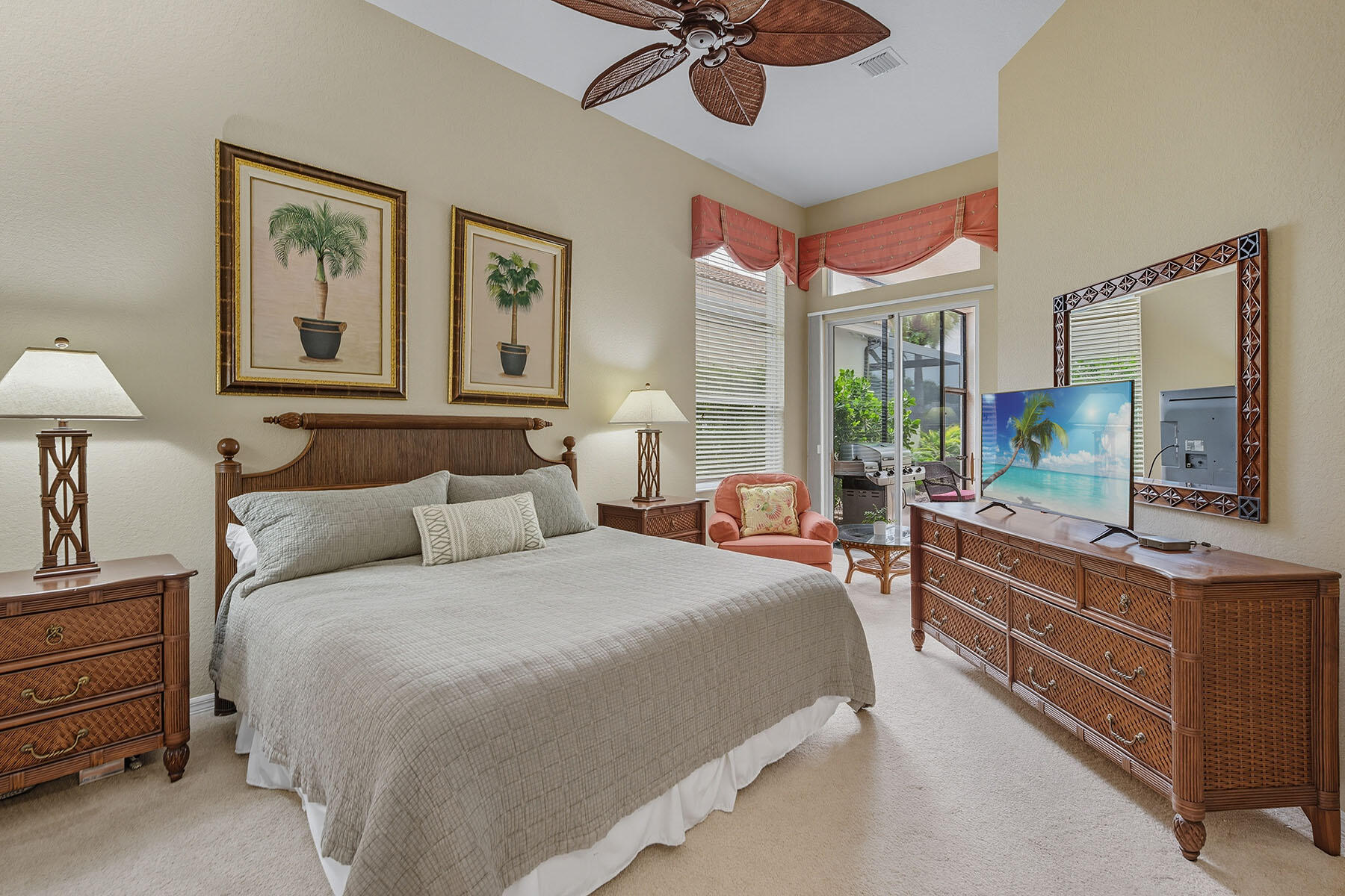 8582 Peppertree Way Naples, FL 34114 - Photo 15 of 50 a bedroom with a bed and a chandelier
