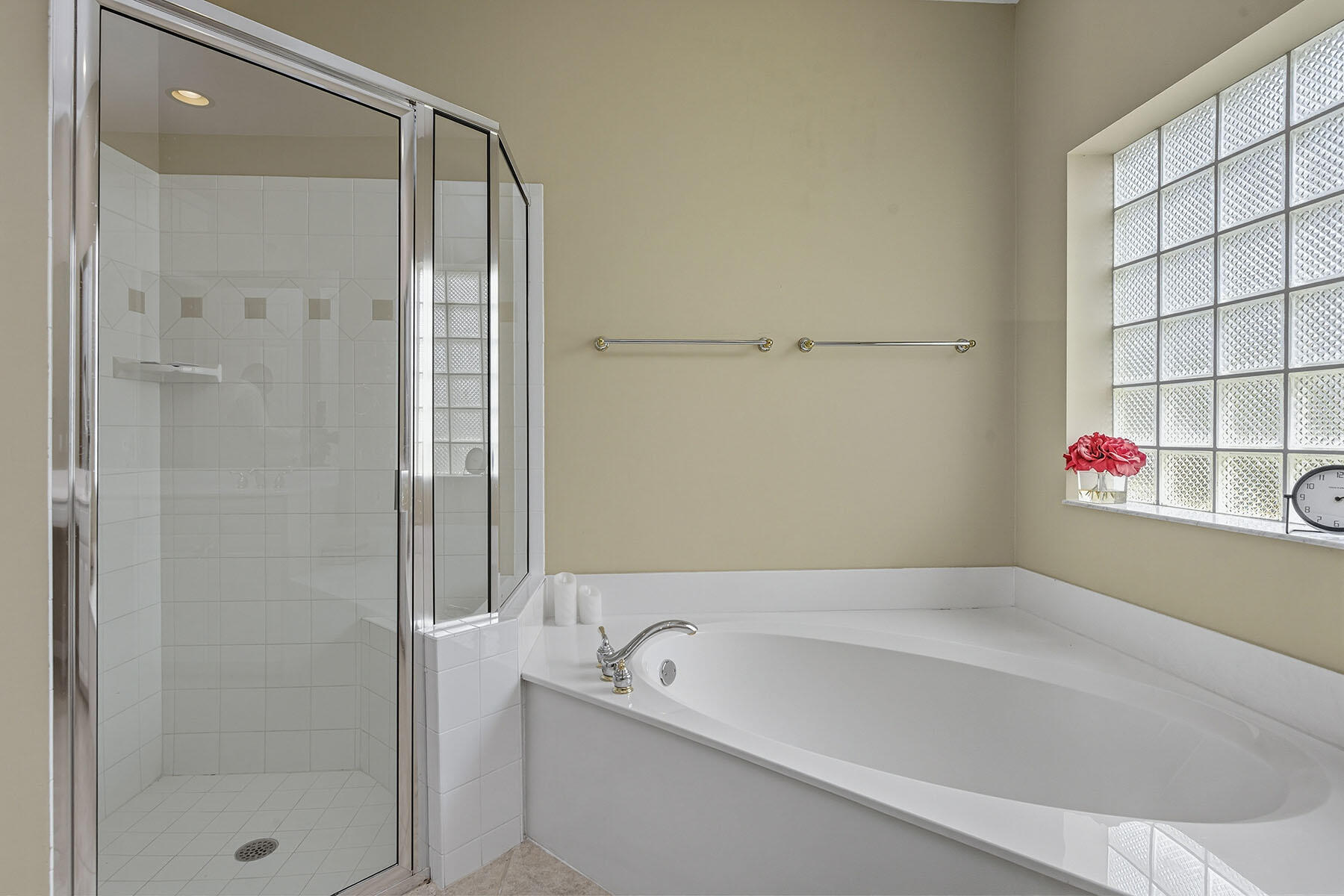 8582 Peppertree Way Naples, FL 34114 - Photo 18 of 50 a bathroom with a tub and shower