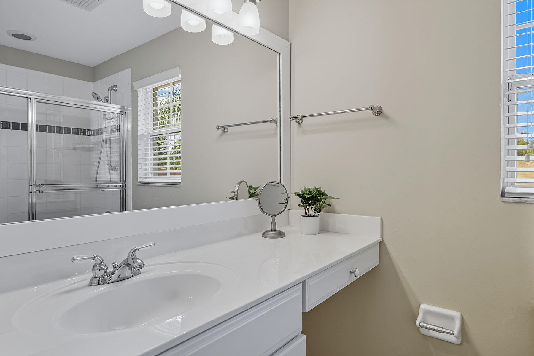 8582 Peppertree Way Naples, FL 34114 - Photo 25 of 50 a bathroom with a sink and a mirror