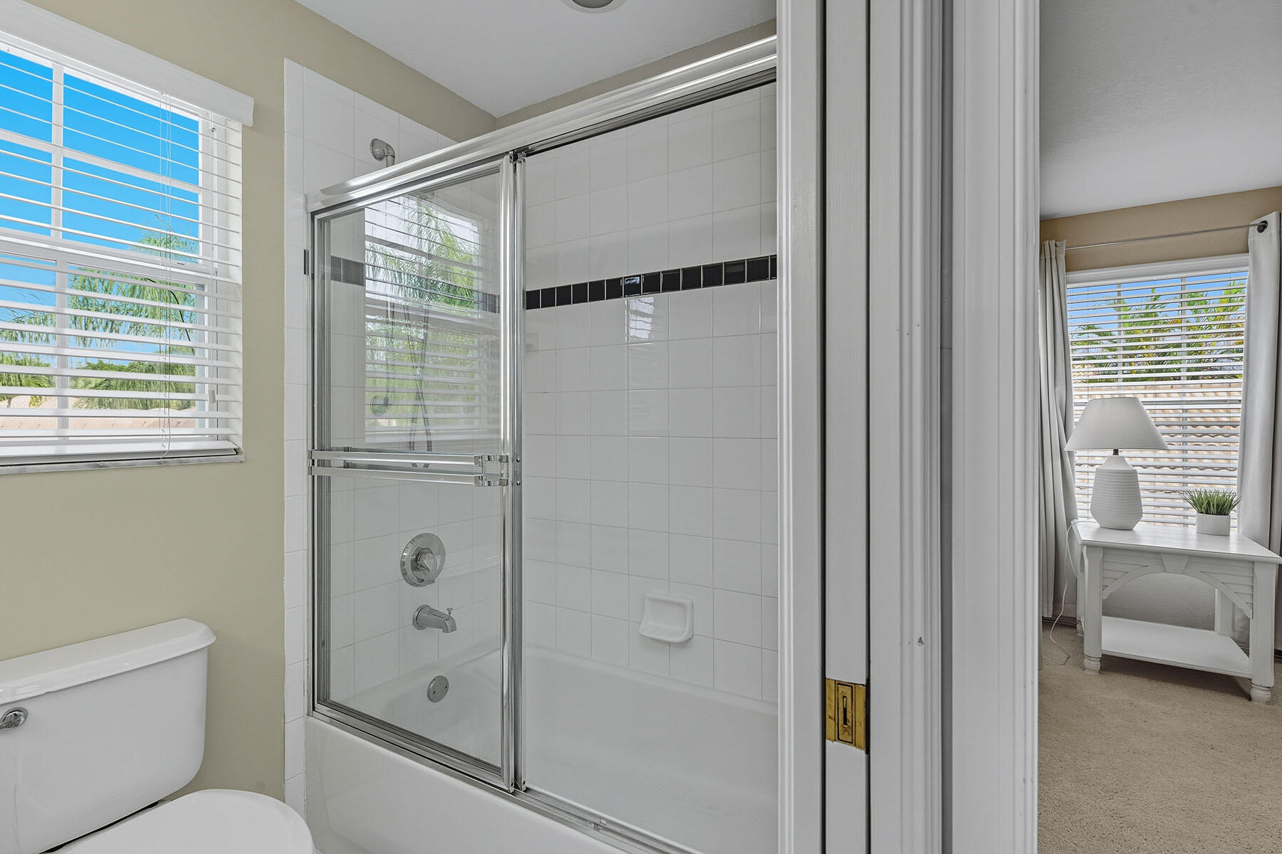 8582 Peppertree Way Naples, FL 34114 - Photo 26 of 50 a bathroom with a glass shower door and a toilet