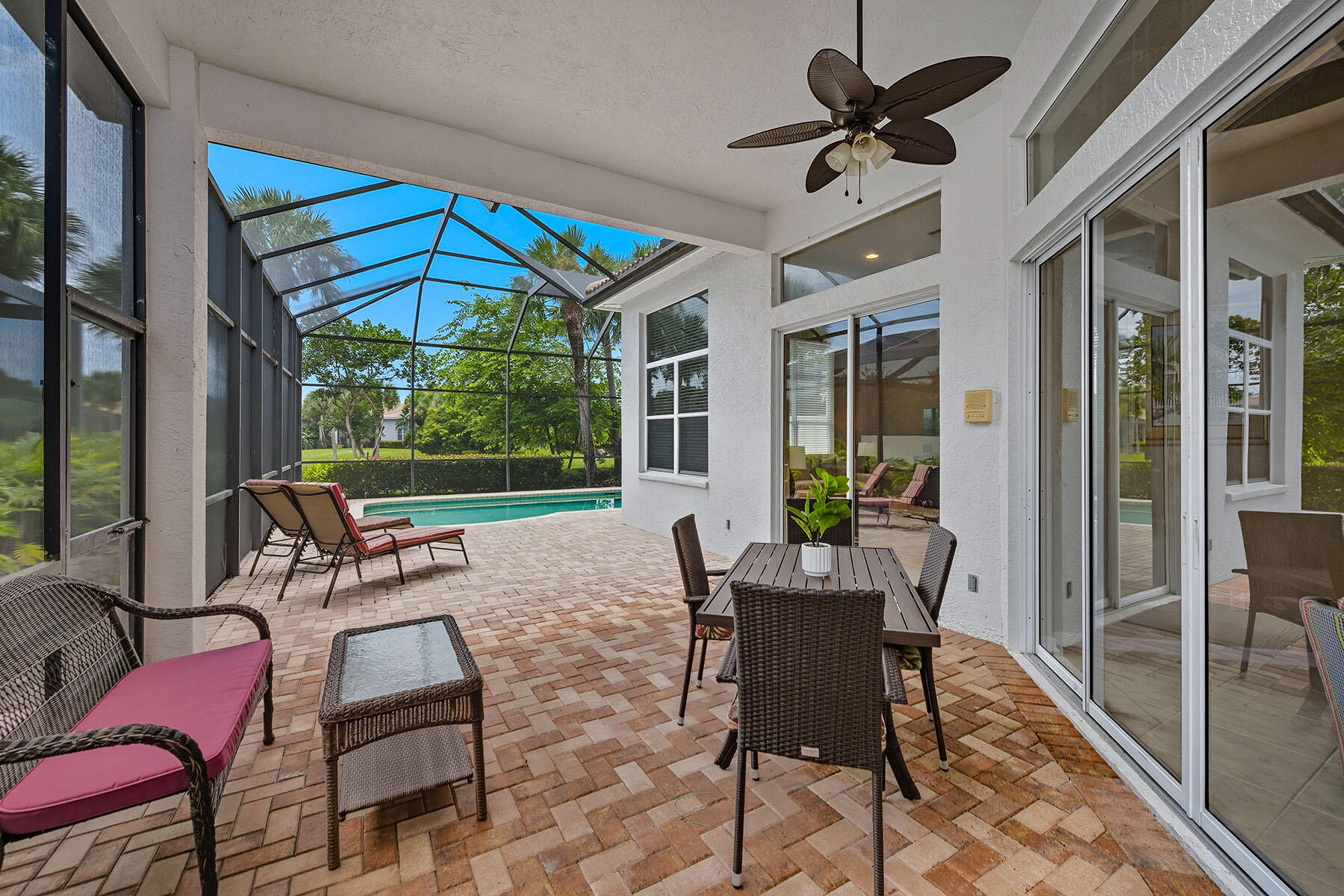 8582 Peppertree Way Naples, FL 34114 - Photo 30 of 50 a view of a patio with a table and chairs