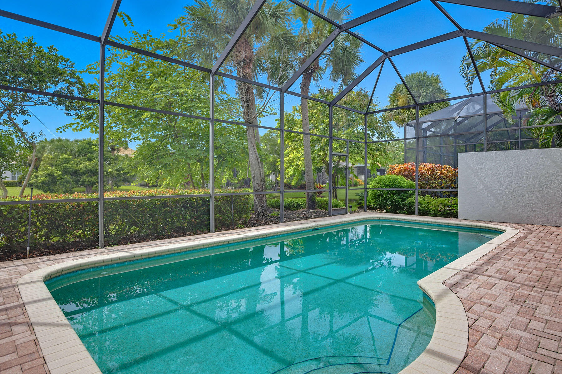 8582 Peppertree Way Naples, FL 34114 - Photo 31 of 50 a view of a backyard with a small swimming pool