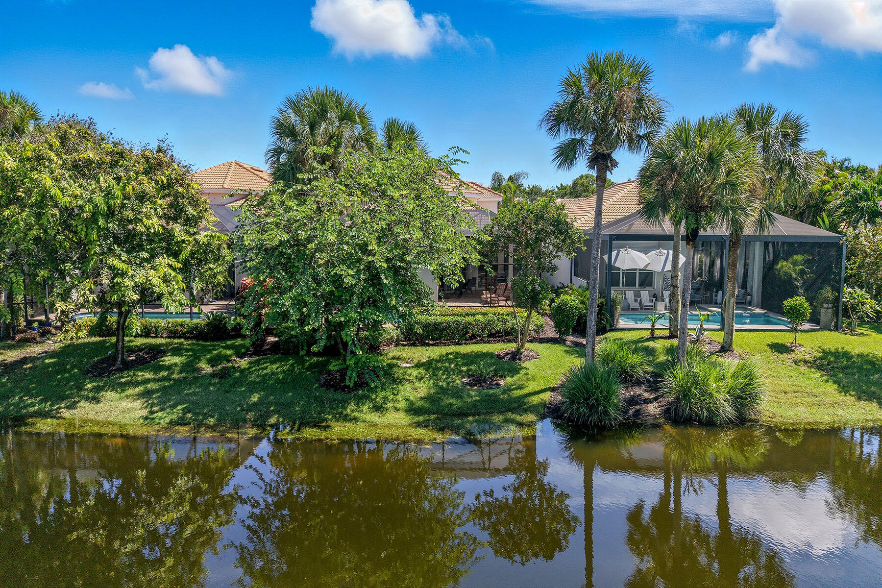 8582 Peppertree Way Naples, FL 34114 - Photo 37 of 50 a view of swimming pool with lawn chairs and plants