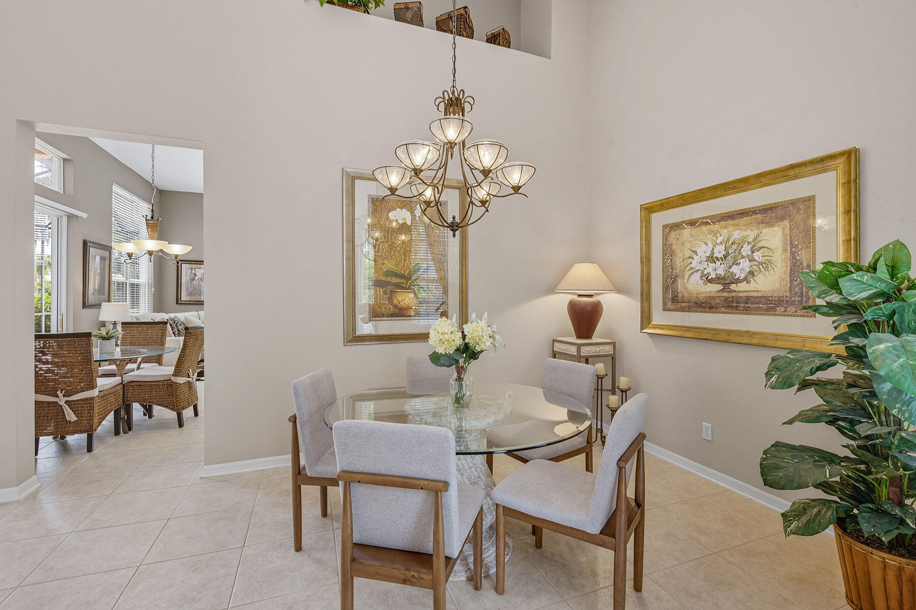 8582 Peppertree Way Naples, FL 34114 - Photo 6 of 50 a dining room with chandelier and wooden floor