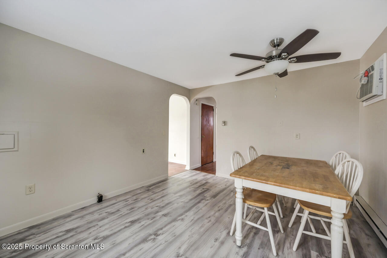 113 Taroli Street Old Forge, PA 18518 - Photo 14 of 41 a workspace with wooden floor and windows