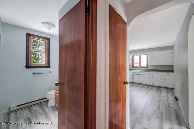 a view of an empty room and a window