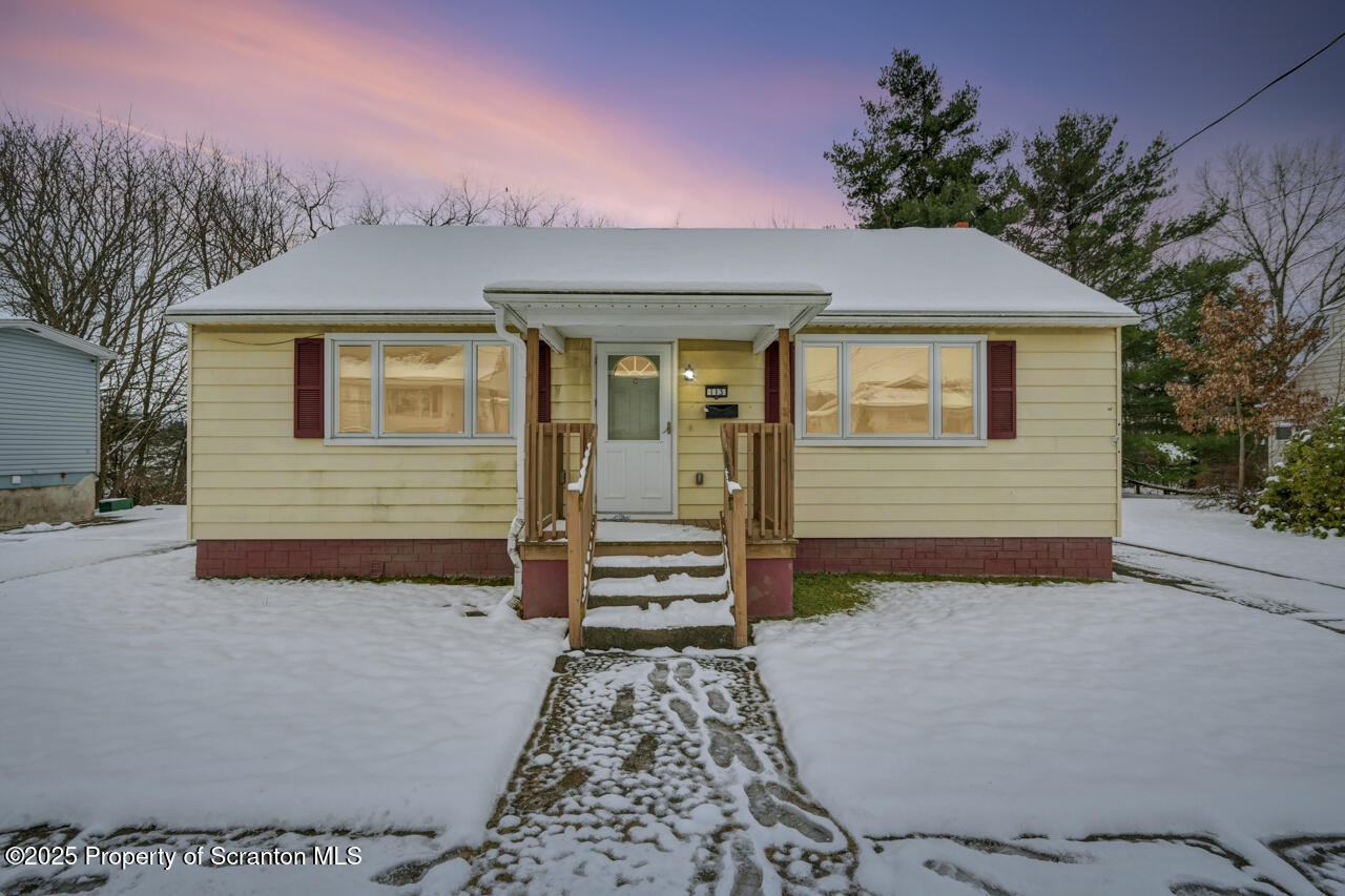 113 Taroli Street Old Forge, PA 18518 - Photo 2 of 41 a front view of a house with a garden