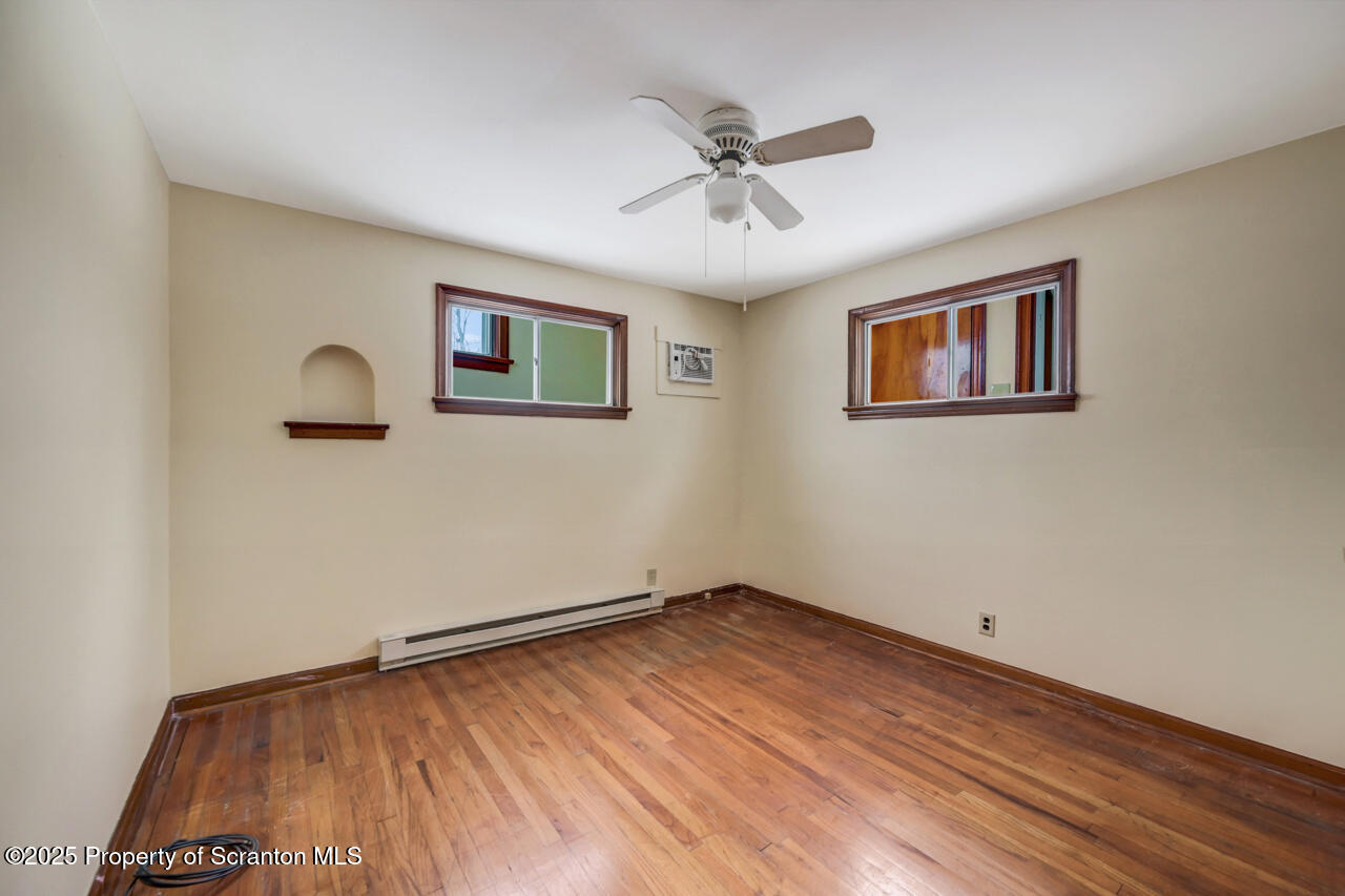 113 Taroli Street Old Forge, PA 18518 - Photo 23 of 41 a view of a room with wooden floor and window