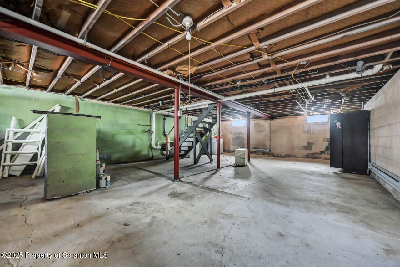 113 Taroli Street Old Forge, PA 18518 - Photo 29 of 41 a view of an empty room with wooden ceiling