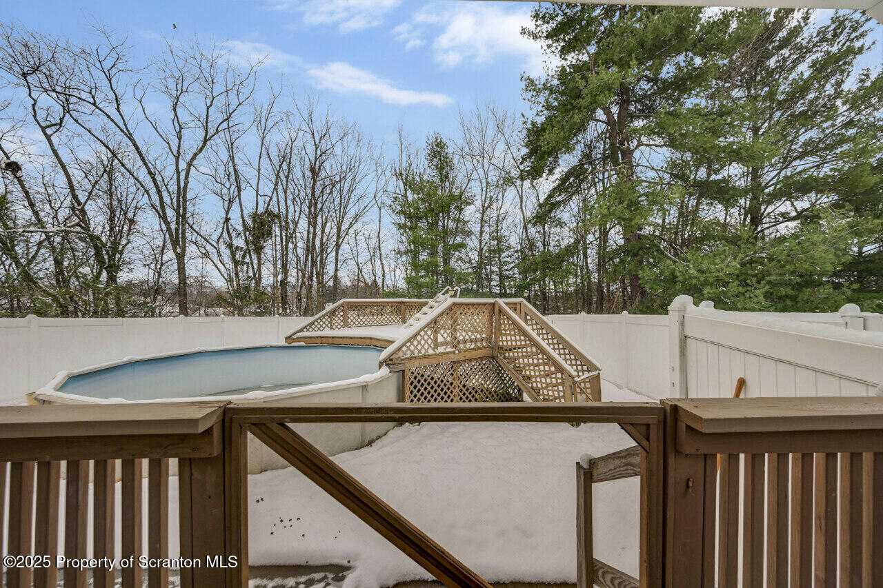 113 Taroli Street Old Forge, PA 18518 - Photo 32 of 41 a view of a house with yard and trees in the background