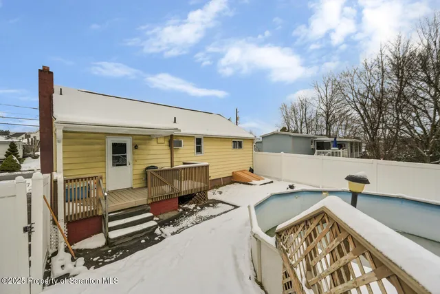 a view of a two chairs in the balcony