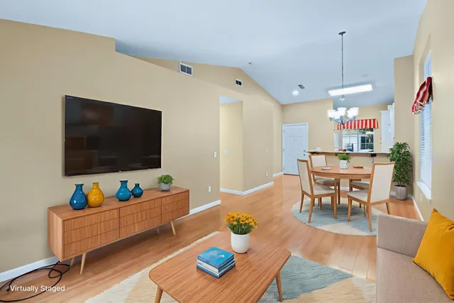 a view of a kitchen with a sink and a refrigerator