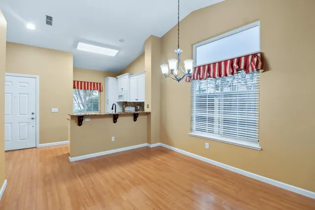 a view of kitchen with furniture and a window