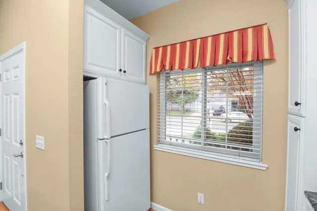 a bedroom with a large bed and a flat screen tv