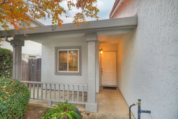 a view of a house with a small yard