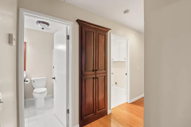 an aerial view of residential houses with outdoor space and street view