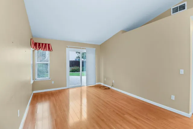 a view of a kitchen with a dishwasher cabinets and wooden floor