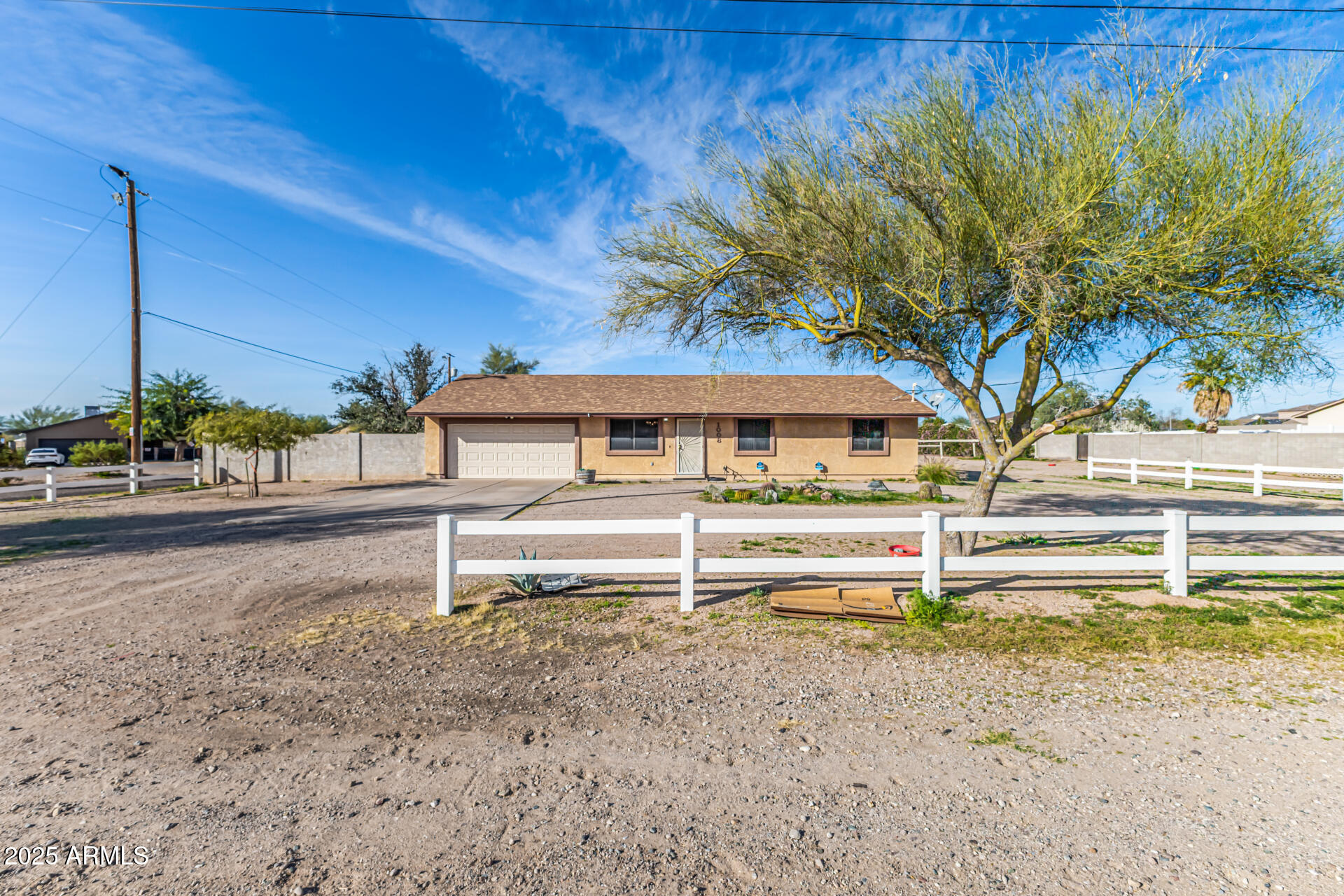 1008 North Meridian Drive Apache Junction, AZ 85120 - Photo 1 of 38 a front view of a house with a yard