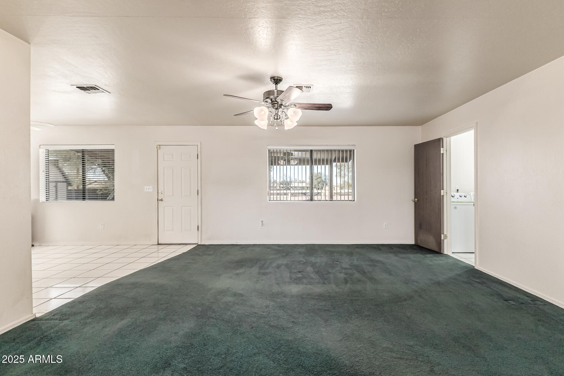 1008 North Meridian Drive Apache Junction, AZ 85120 - Photo 12 of 38 a view of an empty room with a window