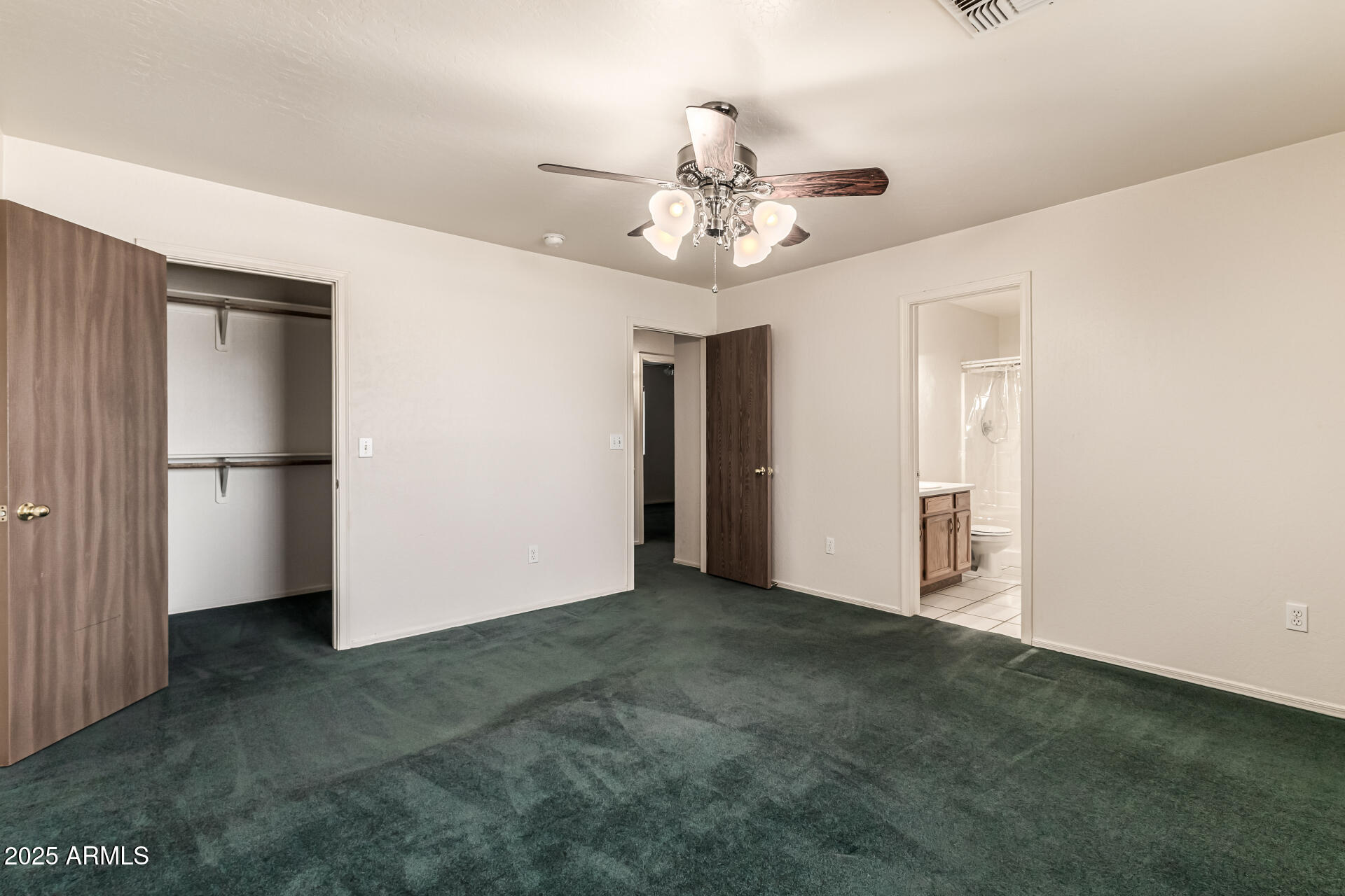 1008 North Meridian Drive Apache Junction, AZ 85120 - Photo 18 of 38 a view of an empty room with a ceiling fan