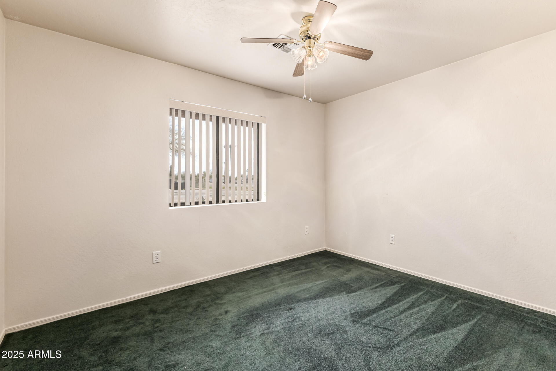1008 North Meridian Drive Apache Junction, AZ 85120 - Photo 21 of 38 an empty room with windows