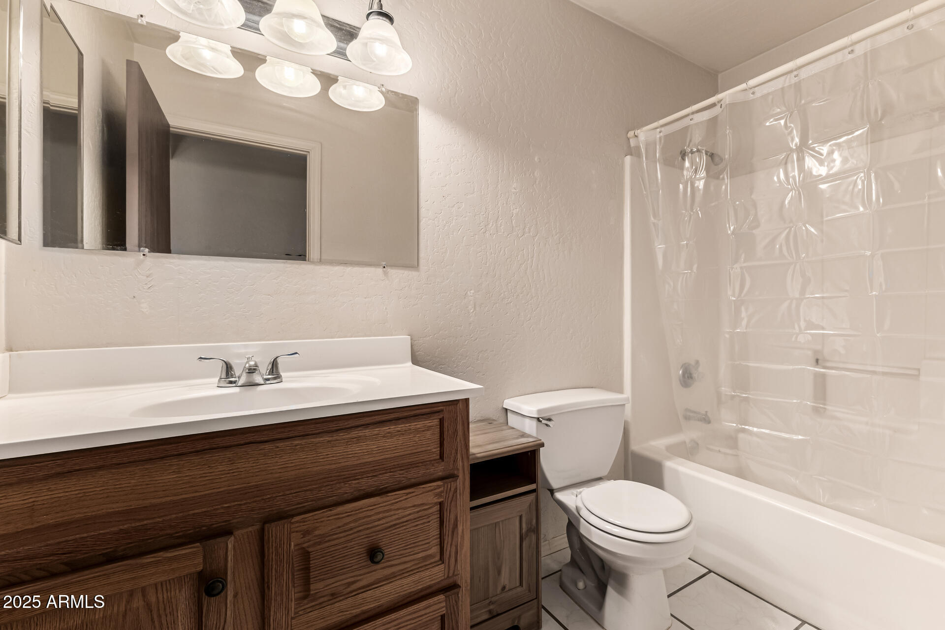 1008 North Meridian Drive Apache Junction, AZ 85120 - Photo 25 of 38 a bathroom with a sink a toilet and shower