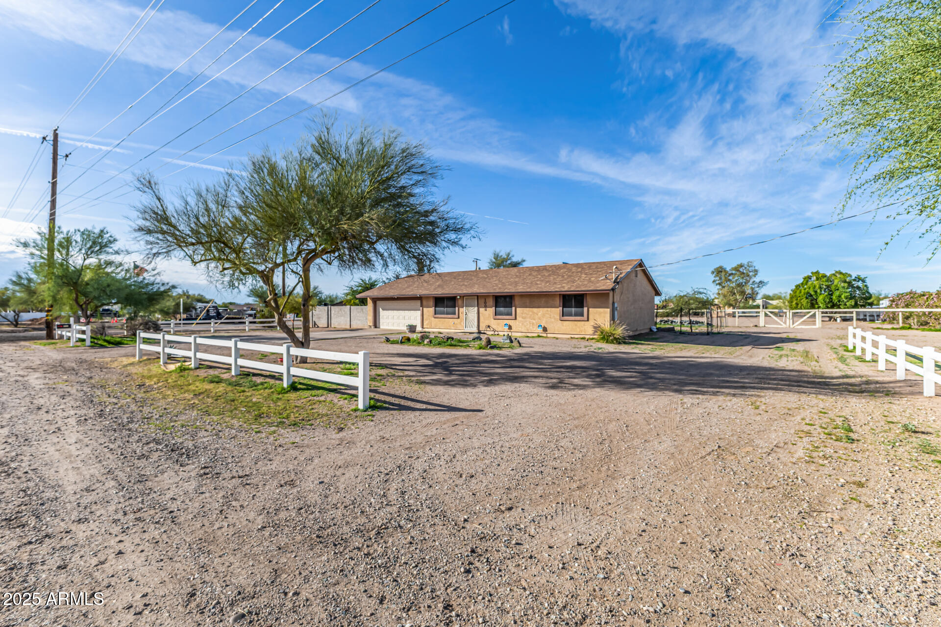 1008 North Meridian Drive Apache Junction, AZ 85120 - Photo 5 of 38 a house with trees in front of it