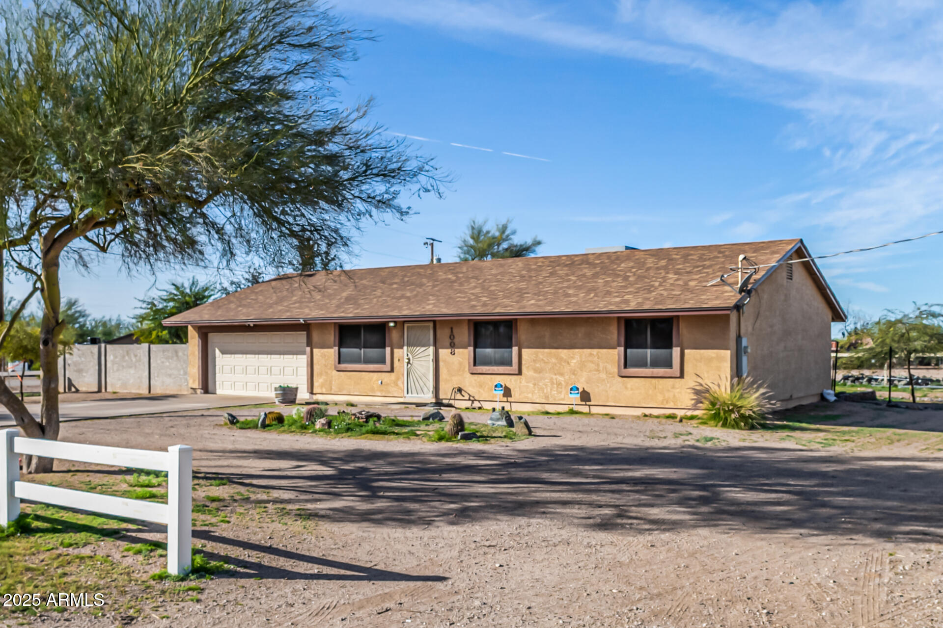 1008 North Meridian Drive Apache Junction, AZ 85120 - Photo 6 of 38 a front view of a house with garden