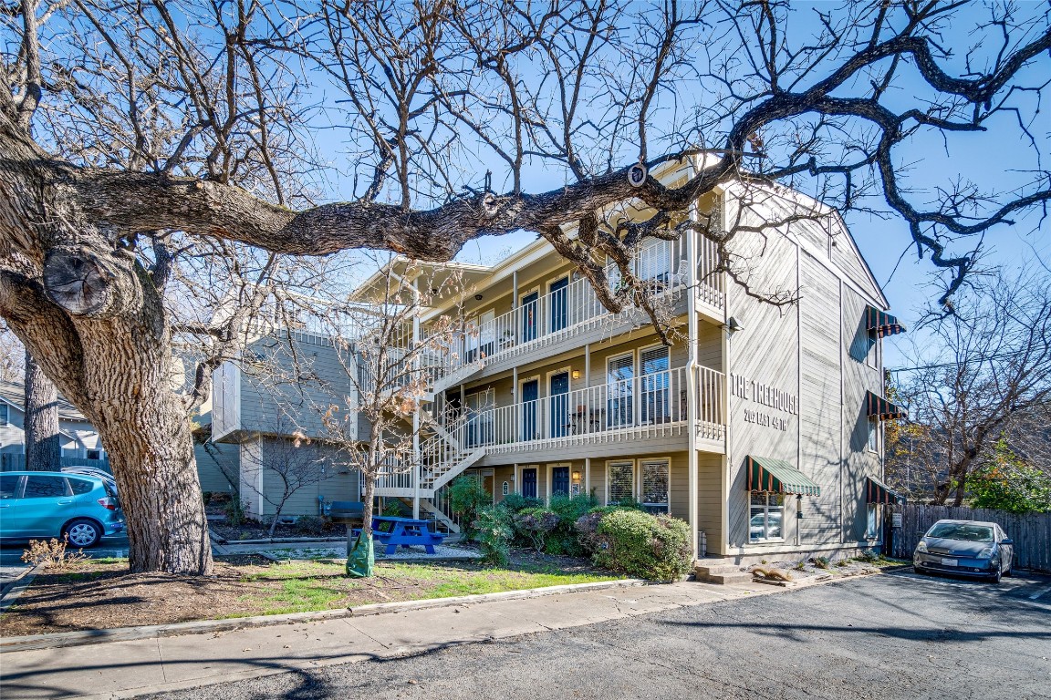 202 East 45th Street, Unit 102 Austin, TX 78751 - Photo 1 of 1 a building with trees in front of it
