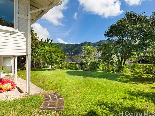 2953 Manoa Road Honolulu, HI 96822 - Photo 1 of 1 a view of a backyard with plants and palm trees