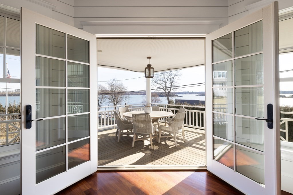 2 Merrill Street Hingham, MA 02043 - Photo 4 of 34 a view of a living room with a floor to ceiling window and wooden floor