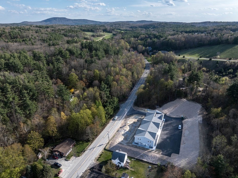150 State Road East, Unit 12 Westminster, MA 01473 - Photo 12 of 13 an aerial view of a house with a yard