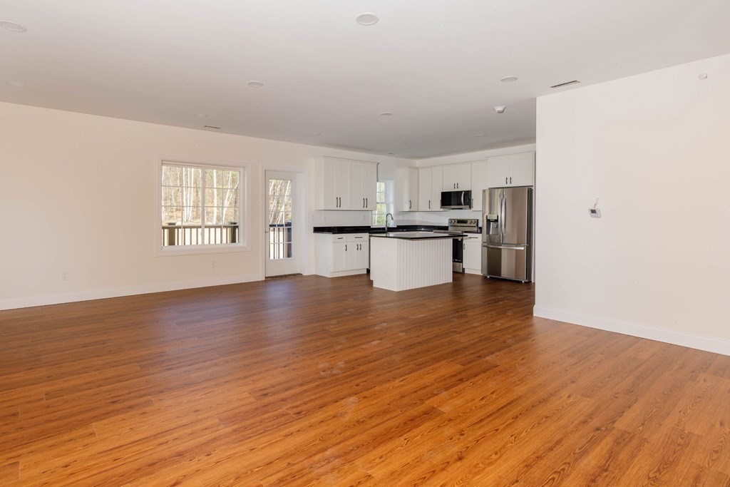 150 State Road East, Unit 12 Westminster, MA 01473 - Photo 4 of 13 a view of kitchen with sink and wooden floor