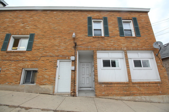 6 National Street, Unit 1 Elgin, IL 60123 - Photo 1 of 6 a view of front door of house
