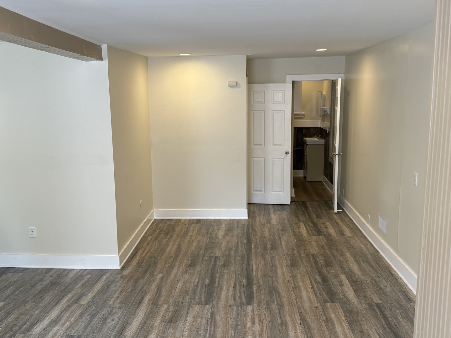 6 National Street, Unit 1 Elgin, IL 60123 - Photo 2 of 6 wooden floor in an empty room with a window