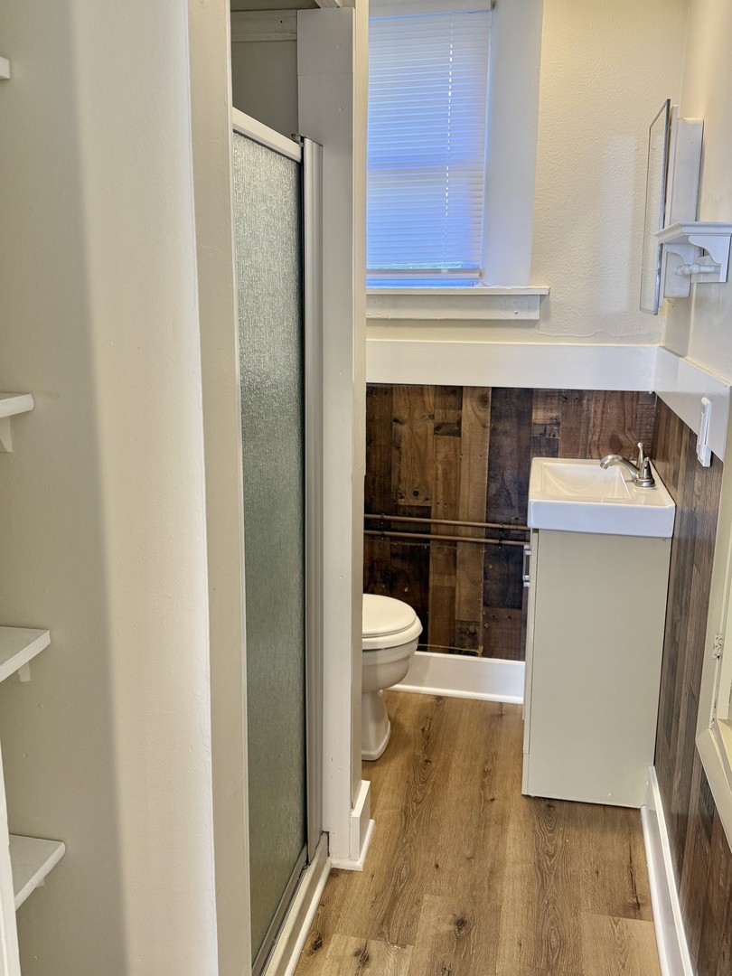 6 National Street, Unit 1 Elgin, IL 60123 - Photo 6 of 6 a bathroom with a sink and a toilet
