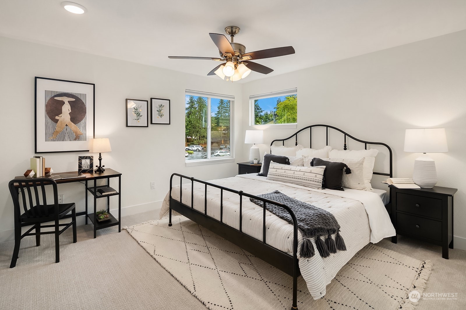 20324 Bothell Everett Highway, Unit F 301 Bothell, WA 98012 - Photo 17 of 28 a bedroom with a bed and a chandelier