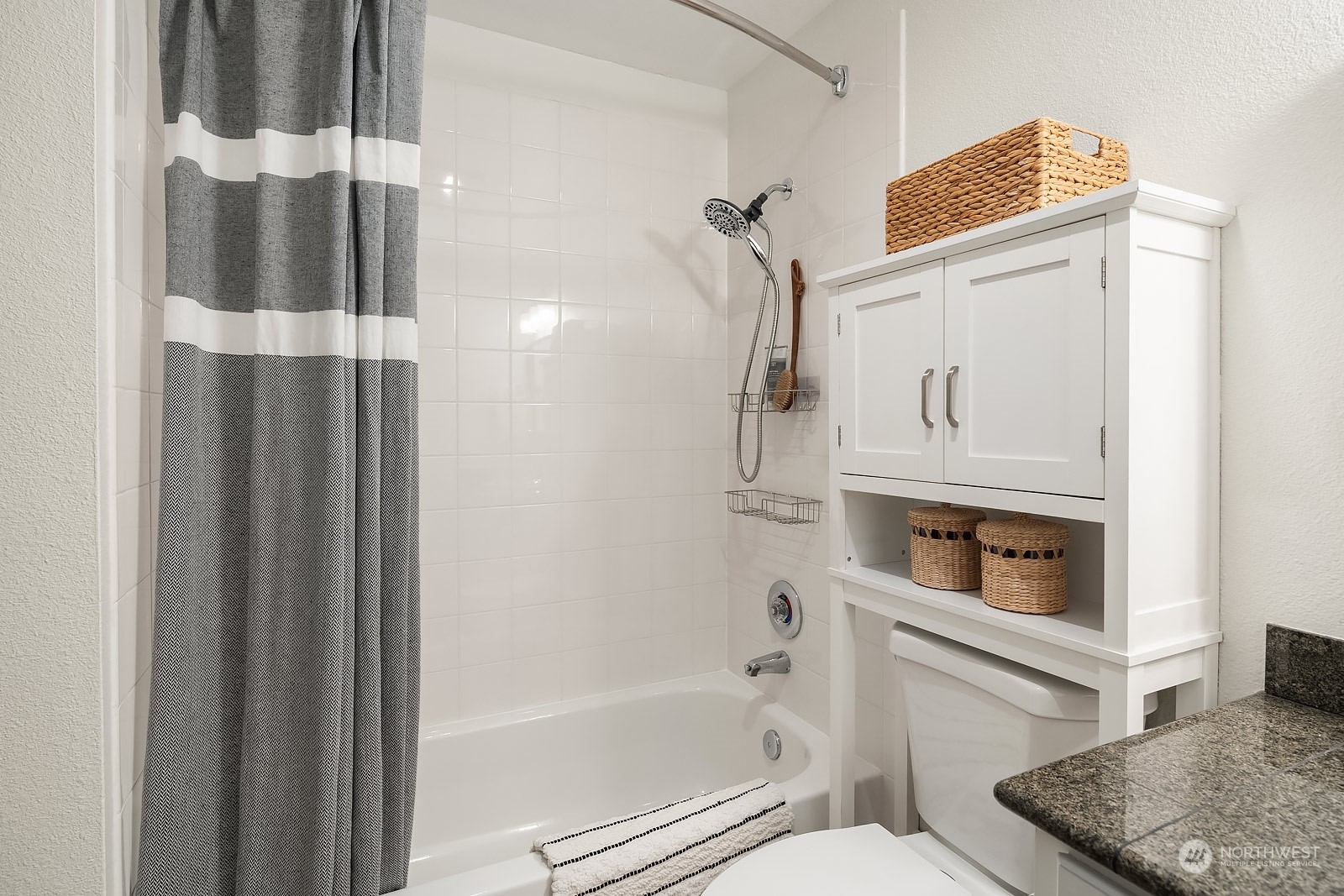 20324 Bothell Everett Highway, Unit F 301 Bothell, WA 98012 - Photo 21 of 28 a bathroom with a toilet and a shower