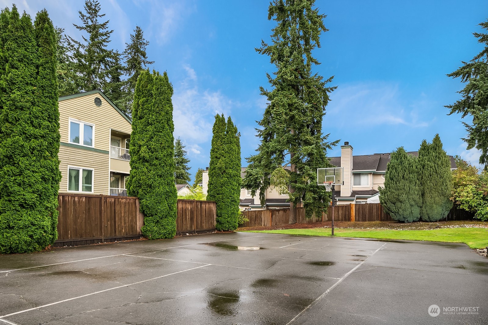 20324 Bothell Everett Highway, Unit F 301 Bothell, WA 98012 - Photo 25 of 28 a view of a house with a yard and large trees