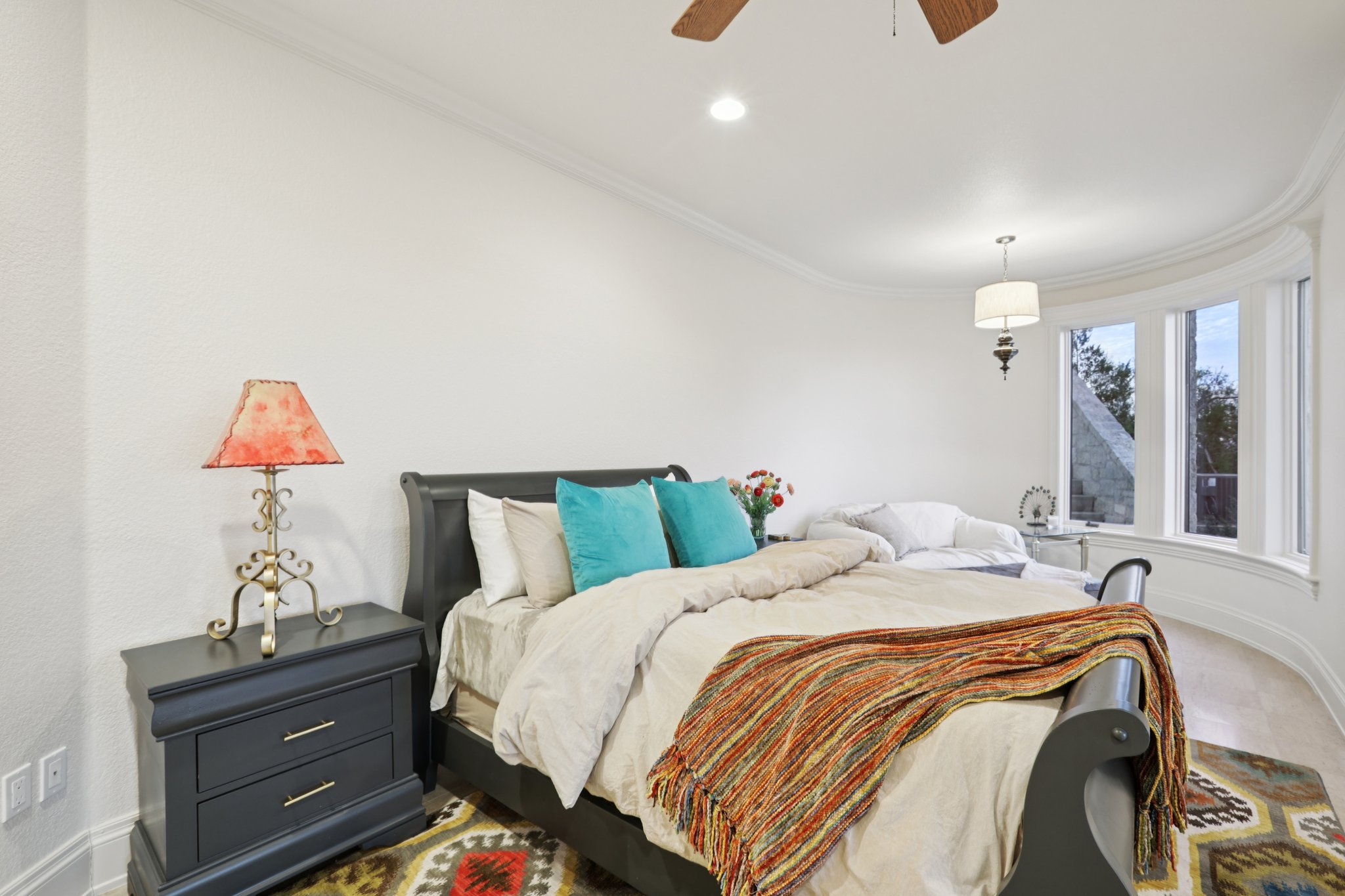 14701 Hornsby Hill Road Austin, TX 78734 - Photo 15 of 40 a bed room with a bed and a chandelier