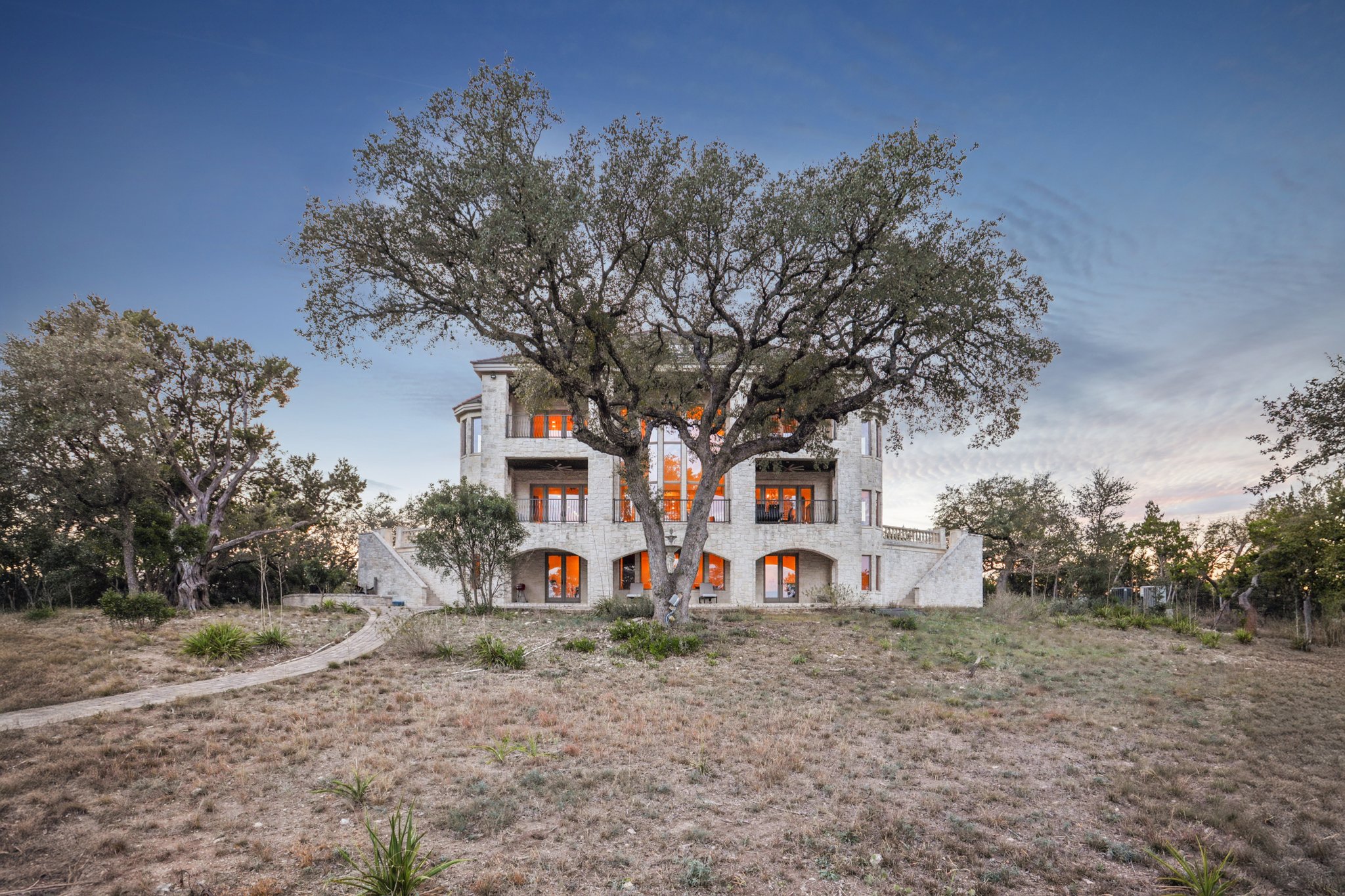 14701 Hornsby Hill Road Austin, TX 78734 - Photo 37 of 40 front view of a house with a trees