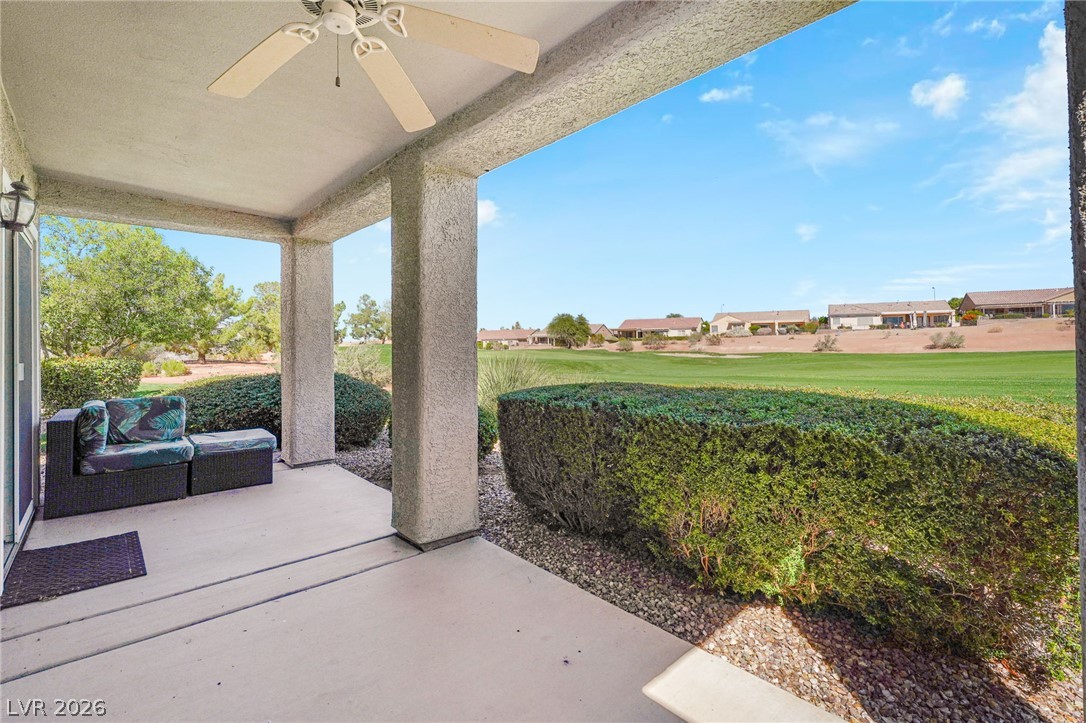 2738 Grand Forks Road Henderson, NV 89052 - Photo 32 of 52 A covered back patio looks out across manicured lawns to the nearby golf course.